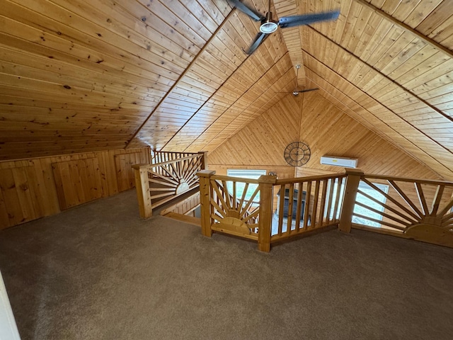 bonus room with carpet floors, wood ceiling, a ceiling fan, wooden walls, and lofted ceiling