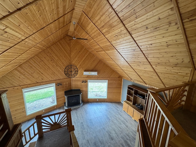 bonus room with wooden walls, vaulted ceiling, wood finished floors, and wood ceiling