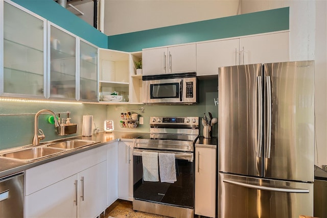 kitchen featuring white cabinetry, sink, and appliances with stainless steel finishes