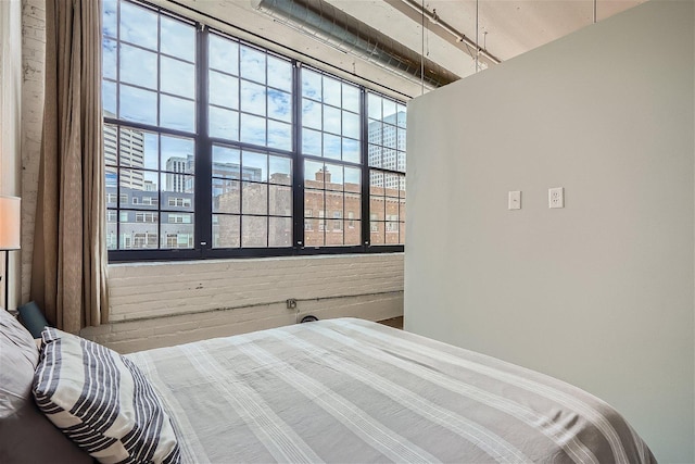 bedroom with brick wall