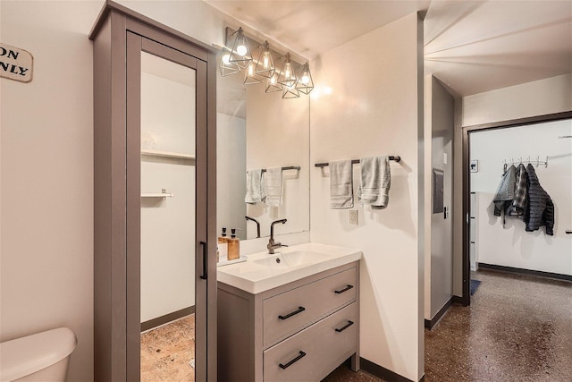 bathroom featuring vanity and toilet