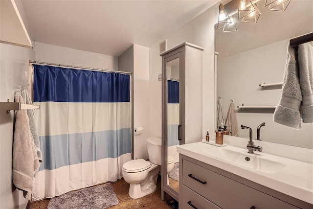 bathroom with curtained shower, vanity, and toilet