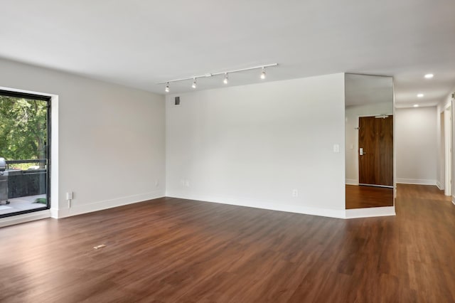 empty room featuring dark wood-type flooring