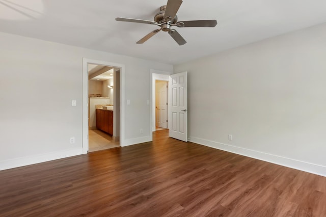 unfurnished bedroom featuring hardwood / wood-style flooring, ceiling fan, and connected bathroom