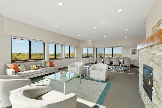 living room with a healthy amount of sunlight and a fireplace