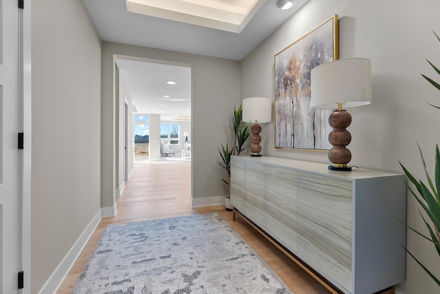 hallway with hardwood / wood-style flooring