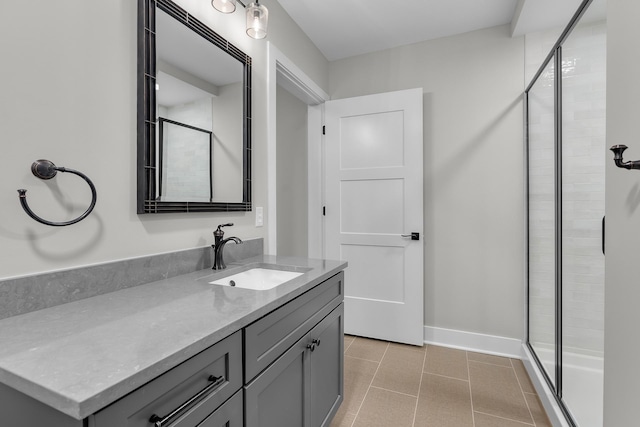 bathroom featuring vanity, tile patterned flooring, and a shower with door