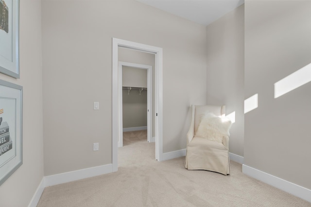 sitting room with light colored carpet