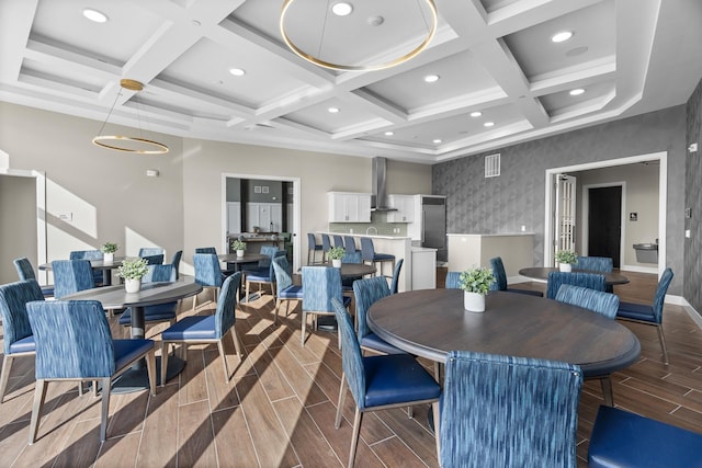 dining space with coffered ceiling and beam ceiling