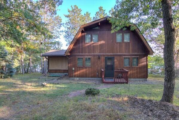 back of house with a yard