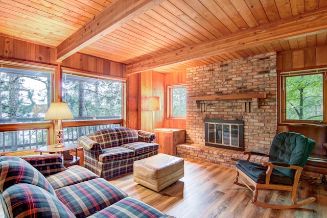 living area with wooden ceiling, wood walls, and hardwood / wood-style flooring