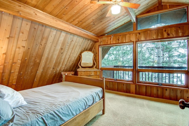 bedroom featuring vaulted ceiling with beams, wood walls, multiple windows, and carpet floors