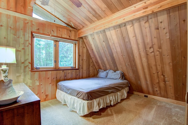 carpeted bedroom with wooden walls, wooden ceiling, and lofted ceiling