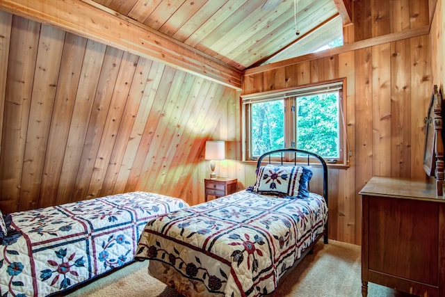 bedroom featuring wooden ceiling, wood walls, and carpet floors