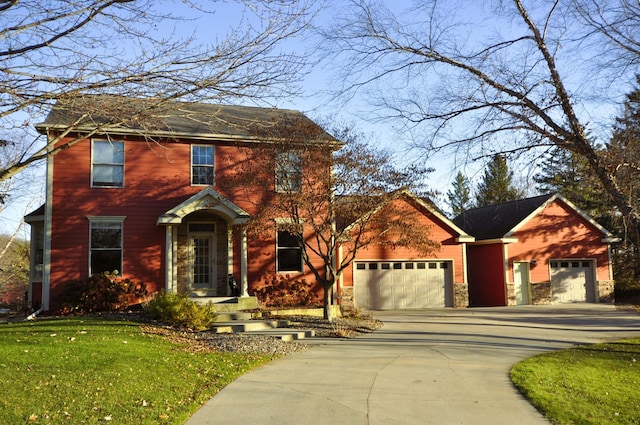 view of front of home with a garage and a front yard