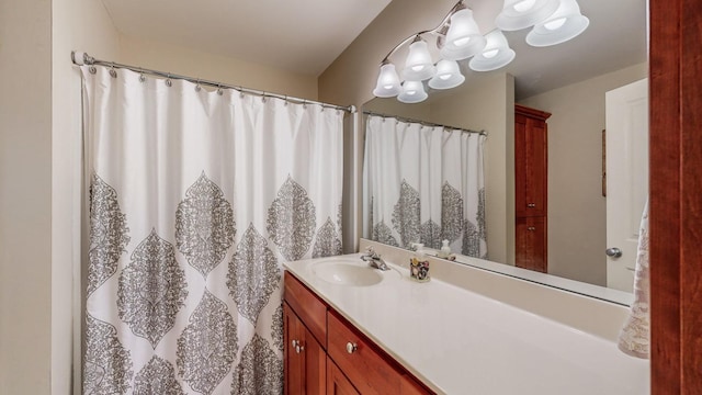 bathroom featuring vanity and an inviting chandelier