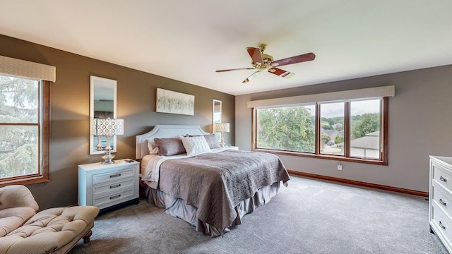 bedroom with light carpet and ceiling fan