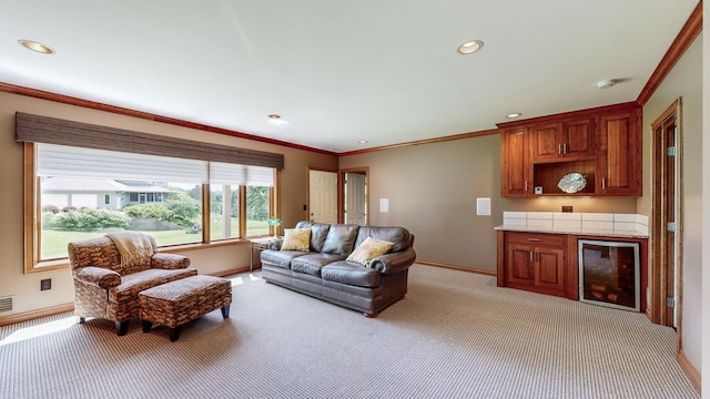 living room with bar, light colored carpet, and crown molding