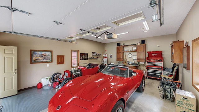 garage with electric panel and a garage door opener