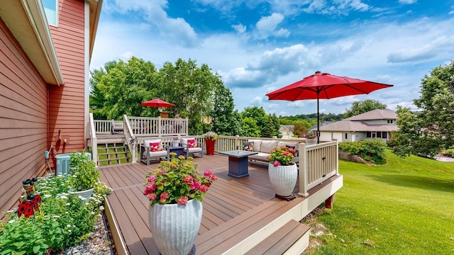 wooden terrace featuring a lawn