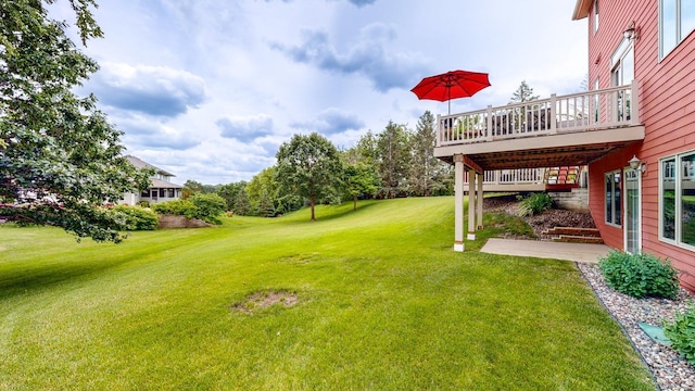 view of yard featuring a wooden deck