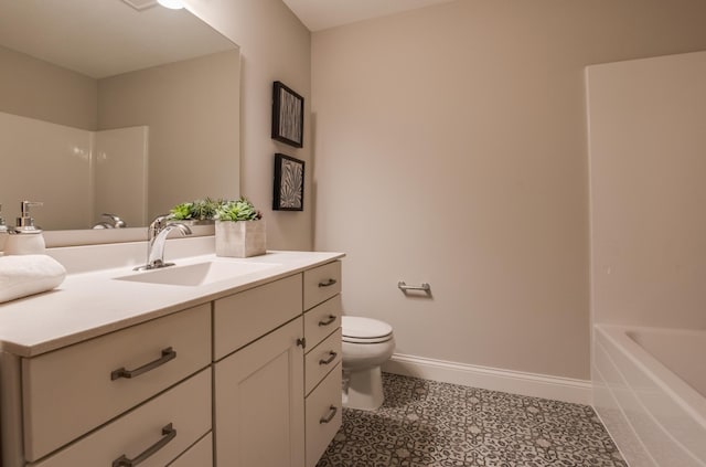 bathroom featuring toilet, vanity, and tile patterned floors