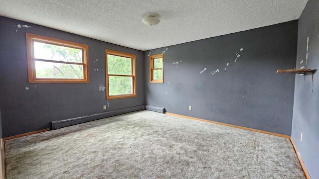 unfurnished room featuring a textured ceiling, a baseboard radiator, and carpet floors