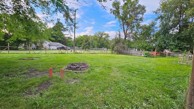 view of yard with an outdoor fire pit