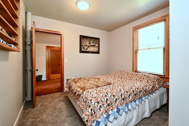 carpeted bedroom with baseboards