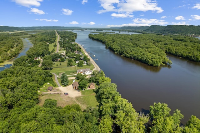 aerial view with a forest view and a water view