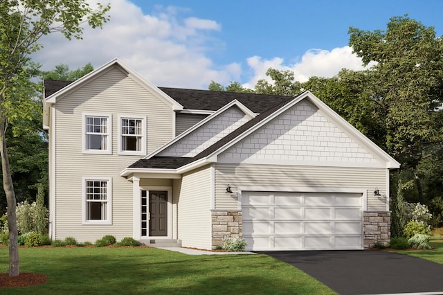 view of front of property featuring a front yard and a garage