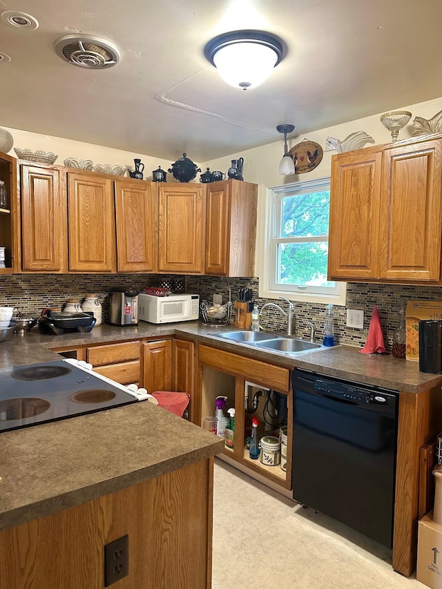 kitchen with sink, dishwasher, range, and tasteful backsplash