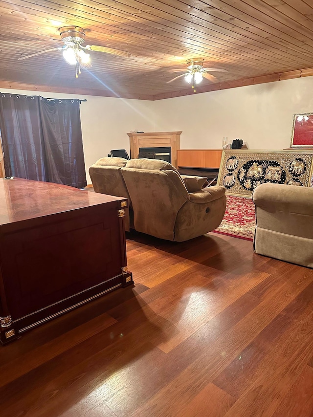 living room featuring ceiling fan, hardwood / wood-style floors, and wood ceiling