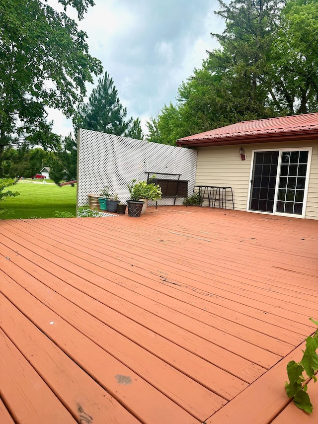 deck featuring a yard