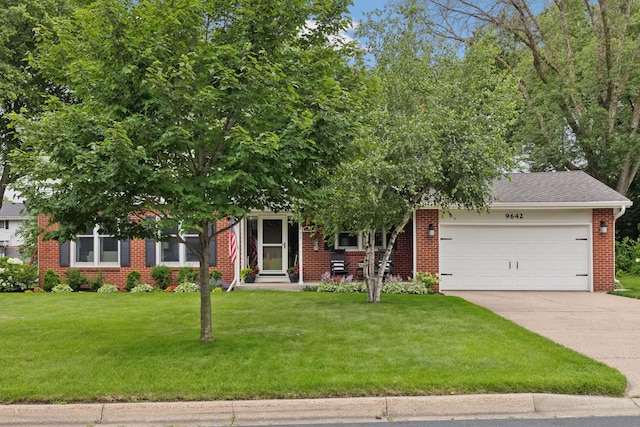 9642 Upton Rd, Minneapolis, MN 55431 - obstructed view of property featuring an attached garage, driveway, a front lawn, brick siding, and roof with shingles