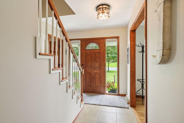 9642 Upton Rd, Minneapolis, MN 55431 - entrance foyer featuring stairs, baseboards, and light tile patterned floors
