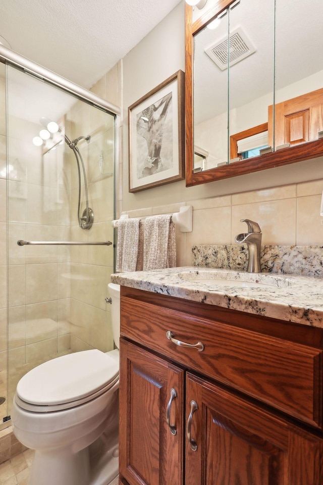 9642 Upton Rd, Minneapolis, MN 55431 - bathroom featuring toilet, vanity, a shower stall, and backsplash