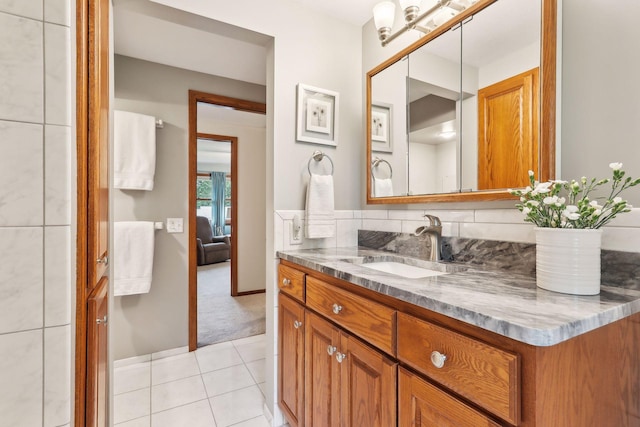 9642 Upton Rd, Minneapolis, MN 55431 - bathroom featuring vanity, tile patterned floors, and ensuite bath