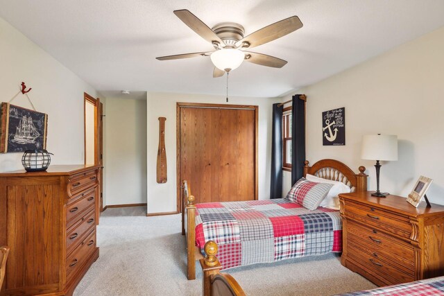 9642 Upton Rd, Minneapolis, MN 55431 - bedroom featuring light carpet, a closet, baseboards, and ceiling fan