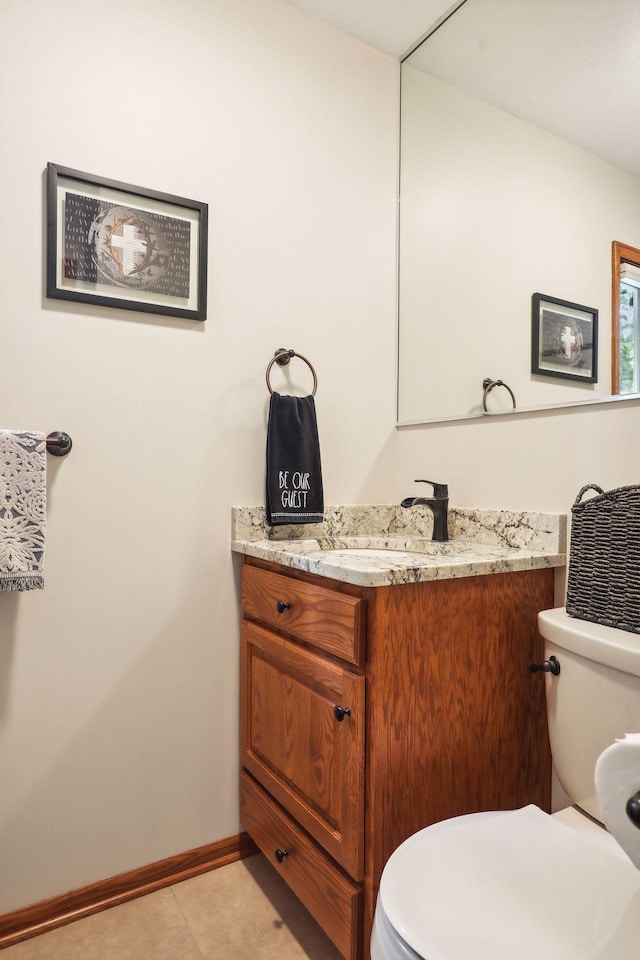 9642 Upton Rd, Minneapolis, MN 55431 - bathroom featuring vanity, toilet, and baseboards