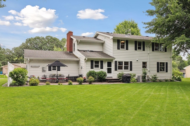 9642 Upton Rd, Minneapolis, MN 55431 - rear view of house with a chimney, a lawn, a patio, and a shingled roof