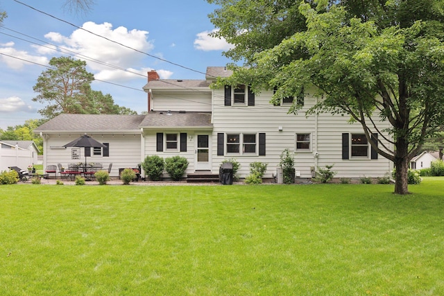9642 Upton Rd, Minneapolis, MN 55431 - back of house featuring a lawn, a patio area, and a shingled roof