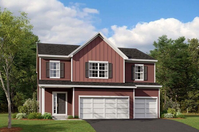 view of front of house featuring a garage and a front yard