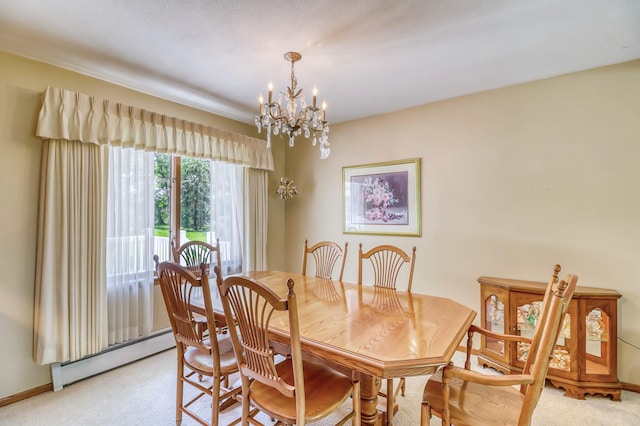 dining area featuring baseboard heating, light colored carpet, and an inviting chandelier