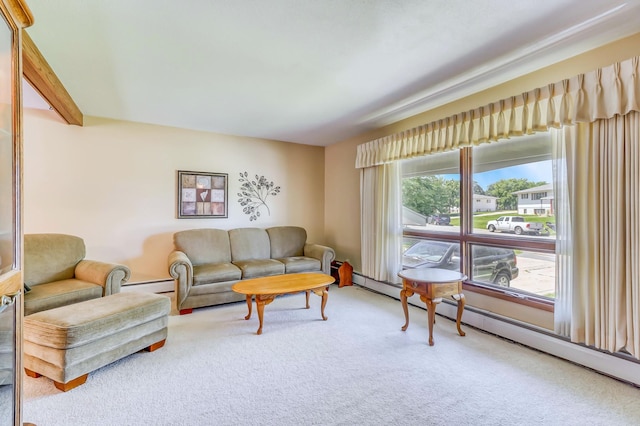 living room with baseboard heating and carpet floors