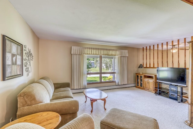 living room featuring carpet and a baseboard heating unit