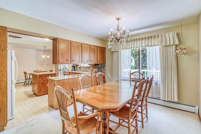 carpeted dining room featuring baseboard heating, sink, and a notable chandelier