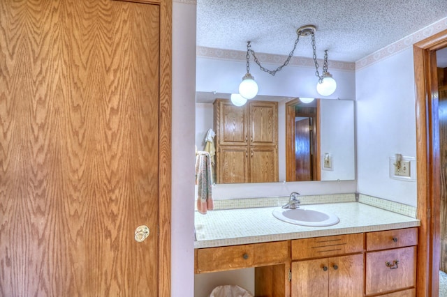 bathroom featuring vanity and a textured ceiling