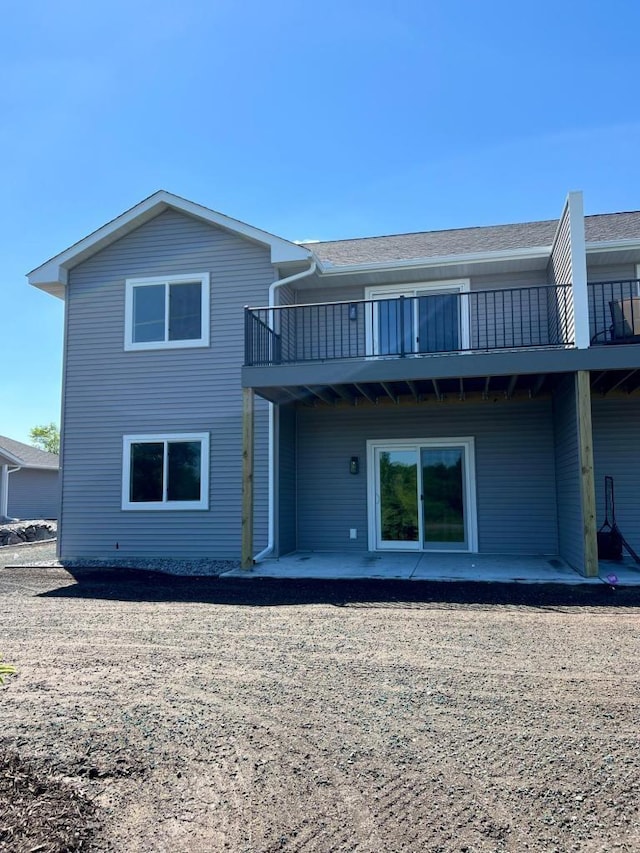 back of house with a patio