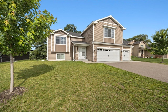 view of front of property featuring a garage and a front yard